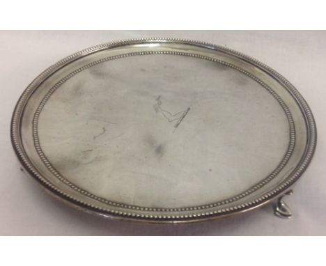 A Georgian 3 footed, Irish silver, salver with arm, dagger and serpent crest to middle. Hallmarked to back Joshua Jackson, Du