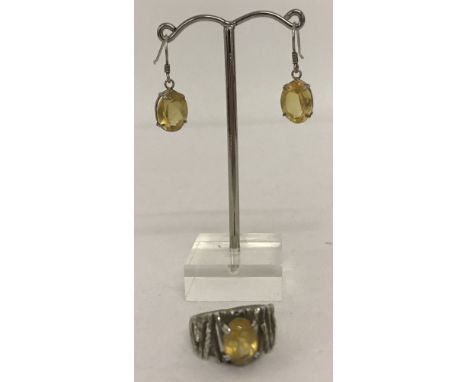 A vintage twig detail dress ring set with oval cut citrine. Together with a pair of citrine set, drop earrings. Ring marked '