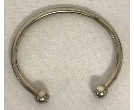 A heavy torque bangle, marked to inside '925 Italy' with scales mark.  Total weight 32.8g.
