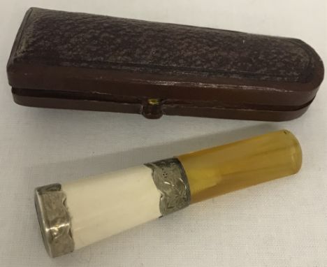 An antique, cased, silver collared cheroot holder. Engraved detail to silver collars. Hallmarked Birmingham 1898 with R B mak