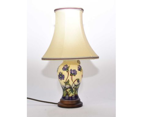 A Moorcroft table lamp in the 'Hepatica' pattern, 18.5cm high including base, with original shade, overall height of lamp inc