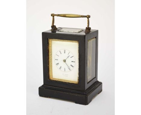 A French ebonised carriage clock, late 19th centuryThe plain four-glass ebonised wood case with brass swing carrying handle, 