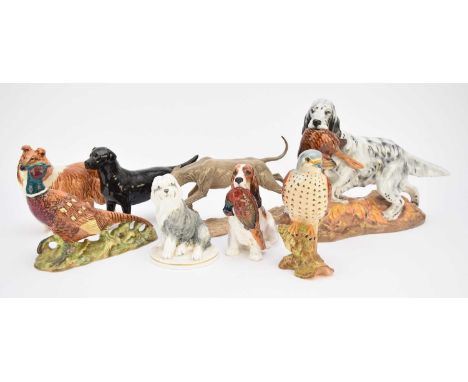 A collection of models of animals, comprising Royal Doulton - Seated Spaniel with Pheasant, HN1028; English Setter with Pheas