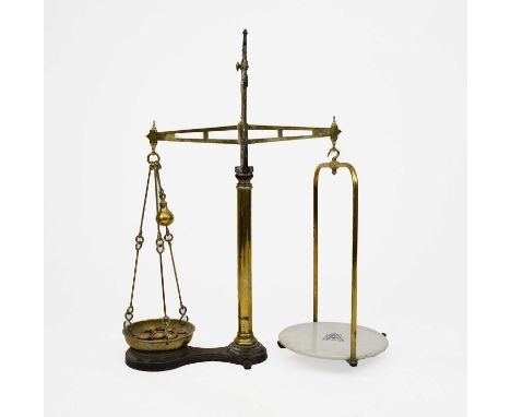 A set of late Victorian cast iron and brass counter top scalesBy Avery, of balance beam type with cast iron frame, brass weig