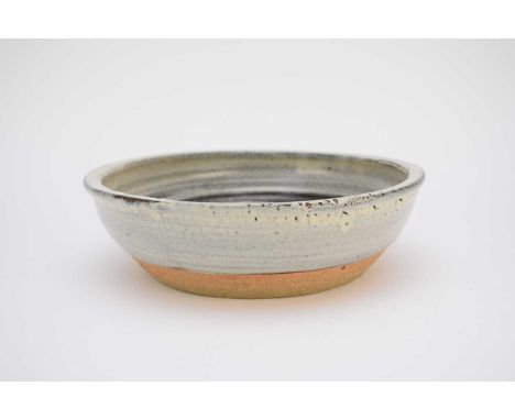 A David Leach (Lowerdown) studio pottery bowl, stoneware with blue glaze, unglazed centre and foot, impressed seal mark, 31.5