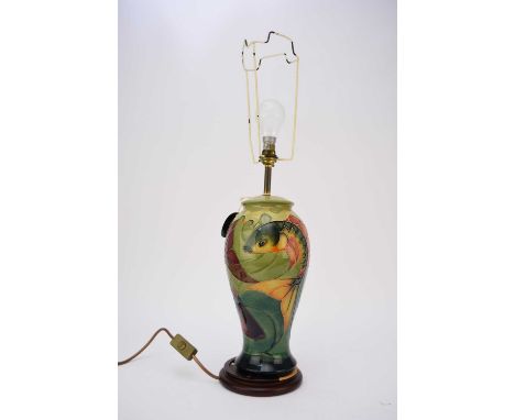 A Moorcroft lamp in the ‘Carp’ pattern designed by Sally Tuffin, height excluding base and fittings 32cm high. With shade.Con
