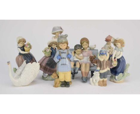 A collection of eight Lladro figures, comprising 'Surrounded by Love', model 6446, 17cm high; a swan, model 6175, 11cm high; 