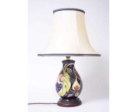 A Moorcroft lamp in the 'Queen’s Choice' pattern designed by Emma Bossons, 22.5cm high with base but excluding fitting, with 