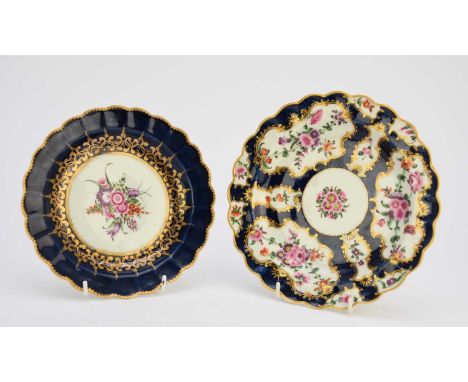 Two Worcester dessert plates, circa 1770, the first scale blue, decorated with reserves of floral sprays to a blue scale grou