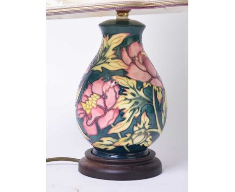 A Moorcroft 'Peony' table lamp designed by Philip Gibson, 22cm high including base but excluding fitting (shade ripped)Condit