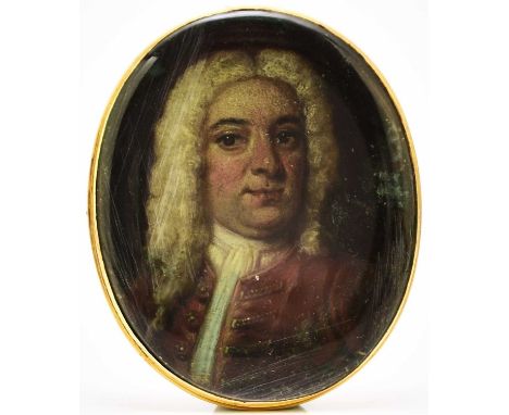 English School (Early 18th Century) Miniature Portrait of a Gentleman wearing a red coat and white wig, painted on metal, ova