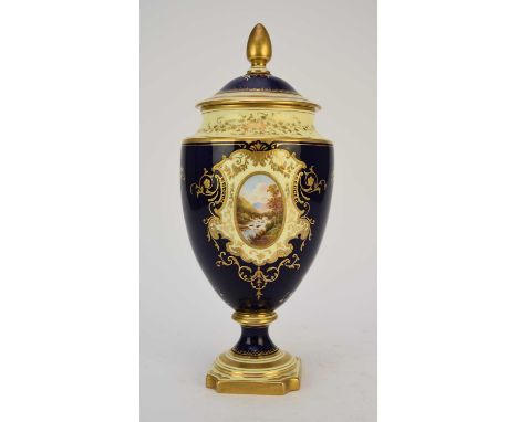 A Coalport landscape vase and cover, circa 1916, of ovoid form, the cobalt and lemon yellow ground painted with an oval lands