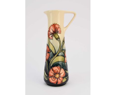 A Moorcroft jug designed by Emma Bossons, dated 1998, pattern name unknown, red flowers on a cream and dark green ground, a n