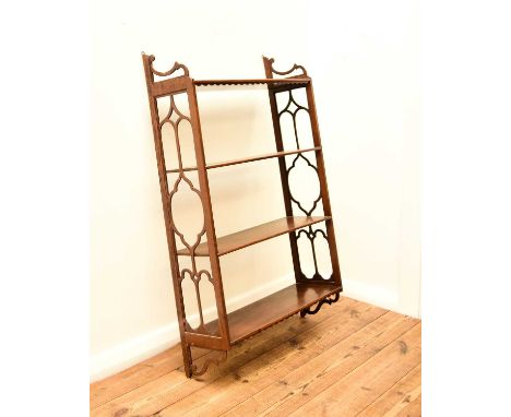 A 19th century mahogany wall shelfThe four tiers with pierced fretwork sides above conforming brackets.56cm wide x 17cm deep 