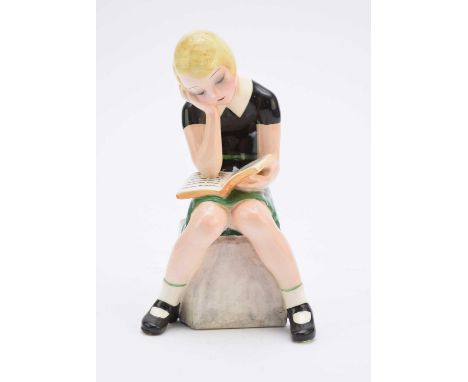A Goldscheider figure of a girl reading a bookmodelled by Claire Weiss, no. 6769, painted 'Weiss' to the reverse of the base'