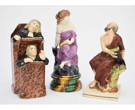 A Staffordshire model of Vicar and Moses, the Vicar asleep at the pulpit, circa 1820, 24cm high; together with a pearlware mo
