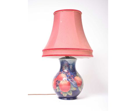 A Moorcroft 'Blue Finches' lamp designed by Sally Tuffin, with red shade, height excluding fitting 24.5cm highCondition:In a 