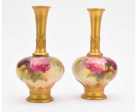 A pair of Royal Worcester vases painted with roses, dated 1922, shape F111, unsigned, printed marks, 15cm high (one broken at