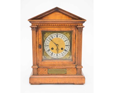A German walnut bracket clock, circa 1895Of architectural form, the brass dial with silvered Roman chapter ring and moulded p