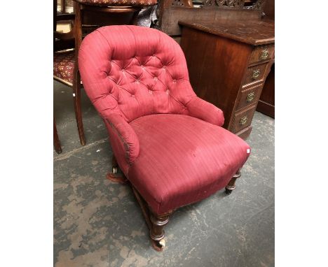 A Victorian button backed bedroom chair, with turned legs and ceramic casters 