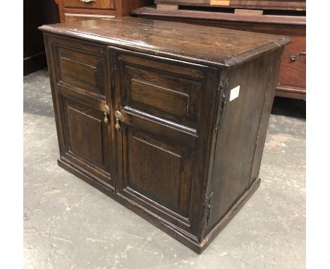 An 18th century table cabinet, two fielded panel doors opening to an arrangement of six shelves, 62x37x49cmH 