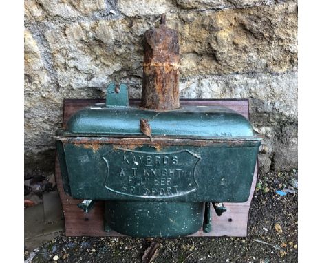 A vintage enamel toilet cistern, reading 'Kay Bros, AT Knight Plumbers, Bridport' 