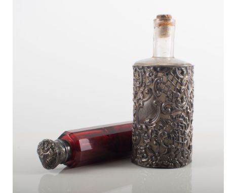 Victorian Ruby glass double-ended scent bottle,  white metal mounts, length 14cms, another scent bottle with a silver mount, 