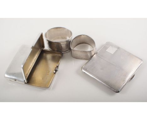 White metal circular compact, engine turned, hallmarked silver cigarette case, engine turned, another silver cigarette case a