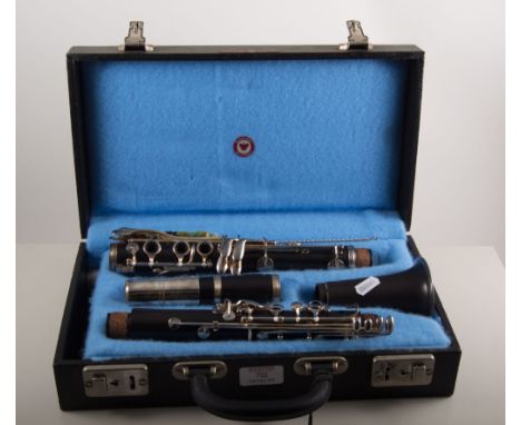 Ebony clarinet, indistinctly marked and stamped Louis, in a hard case, labelled Rudall Carte.
