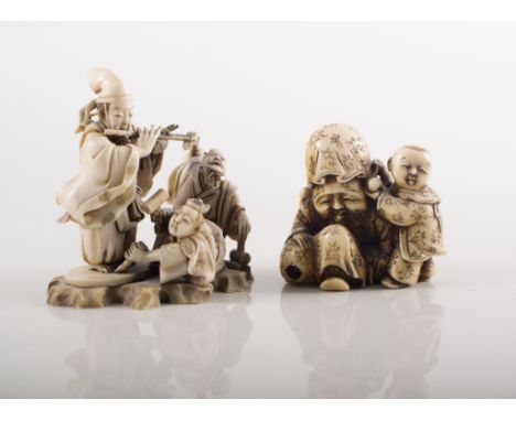 Japanese carved ivory Netsuke, modelled as a elder, with a with a child, indistinctly signed, probably Meiji, 5cms and two ot