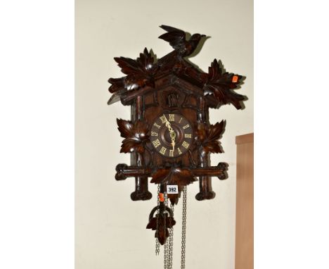 AN EARLY 20TH CENTURY BLACK FOREST CUCKOO CLOCK, bird on branch pediment, loose, wooden dial, Roman numerals, wooden pendulum