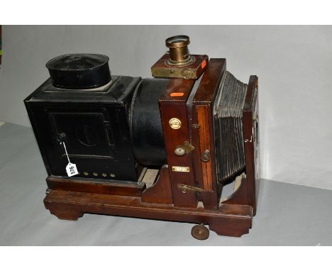 A THORNTON PICKARD RUBY ENLARGER with mahogany case, lens and blacked tin lamp box and lens tube (front lens carriage detatch