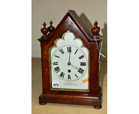 AN EARLY VICTORIAN MAHOGANY CASED BRACKET CLOCK OF TRIANGULAR ARCH FORM, four finials flanking the Gothic arch white painted 