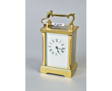 A MODERN BRASS CARRIAGE CLOCK, white enamel dial with Roman numerals, swing handle, fire bevel edge glazed panels, height wit