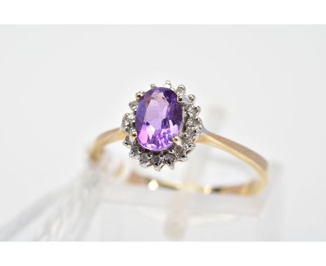 A 9CT GOLD AMETHYST AND DIAMOND CLUSTER RING, the oval amethyst within a single cut diamond surround, with 9ct hallmark, ring