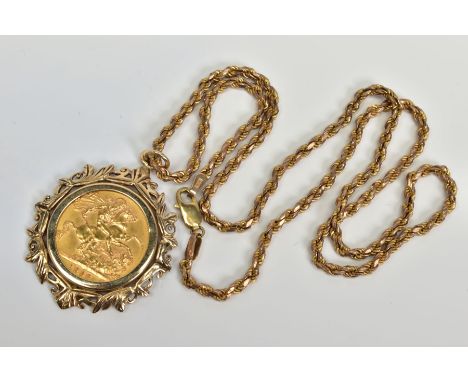 A SOVEREIGN PENDANT AND CHAIN, the full 1958 sovereign within a 9ct gold foliate surround suspended from a rope twist chain t