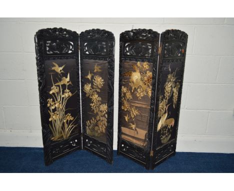 A PAIR OF LATE 19TH/EARLY 20TH CENTURY ORIENTAL EBONISED SINGLE FOLD SCREENS with tapestry inserts (sd to one panel)