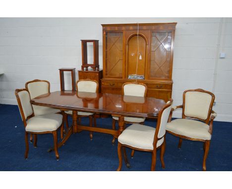 A REPRODUCTION YEW WOOD DINING/LOUNGE SUITE, comprising an extending draw leaf table with one additional leaf, extended lengt