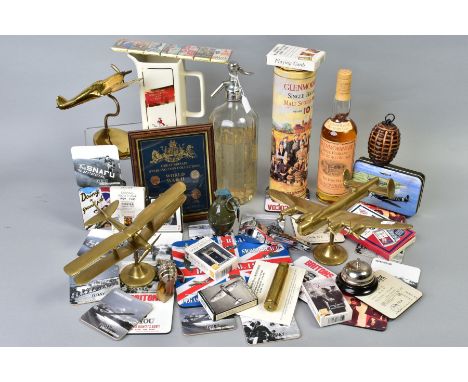 A COLLECTION OF MILITARY INTEREST ITEMS to include brass models of a Lancaster bomber and Spitfire, impressed R A F to the ba