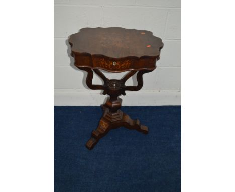 A VICTORIAN ROSEWOOD AND FLORALLY INLAID WORK TABLE, the wavy edge top enclosing an assortment of shaped lidded partitions wi