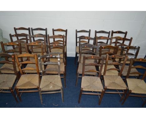 TWENTY FOUR RUSH SEATED LADDER BACK CHAIRS, all with matching/similar backs, some with losses and breaks (24)