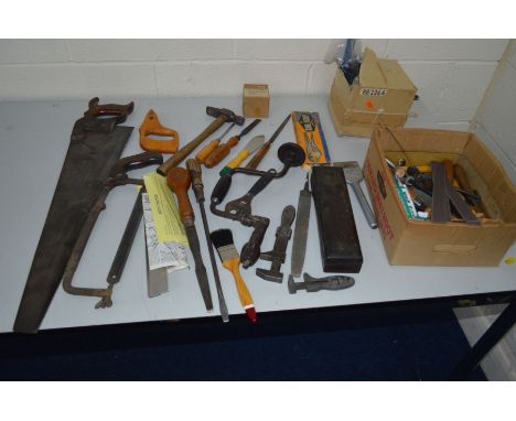 A BOX CONTAINING VARIOUS VINTAGE HAND TOOLS including saws, chisels, hand drill, etc
