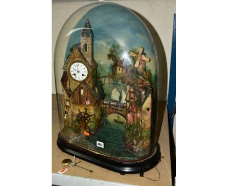 A VICTORIAN AUTOMATON MUSICAL CLOCK UNDER GLASS DOME, clock movement set within a tower, enamel dial, Roman numerals, eight d