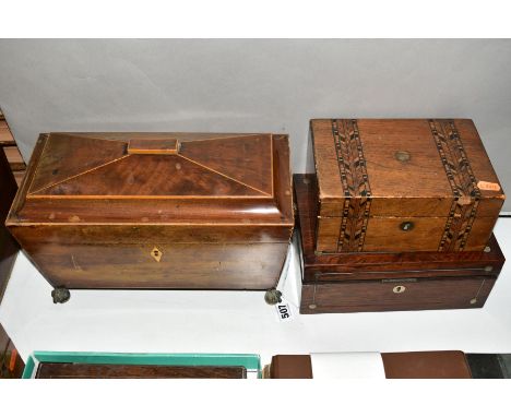 A MAHOGANY TEA CADDY OF SARCOPHAGUS FORM, twin compartments with glass mixing bowl, gilt ball and clawfeet and lion mask hand