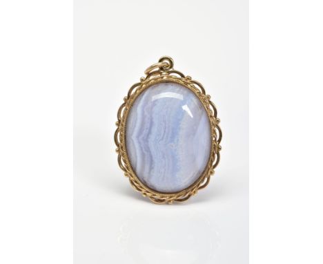 A BLUE LACE AGATE PENDANT, the oval blue lace agate cabochon within a rope twist and scalloped and bead surround, length 36mm
