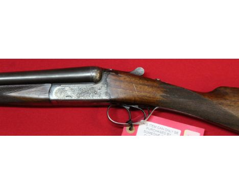 A 12 bore side-by-side B.L.E. shotgun with 28" barrels having good bores by Miroku, S/No.165272, this item can only be purcha