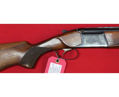 A 12 bore O/U shotgun by Baikal with 28 1/2" barrels having good bores, S/No.00137, this item can only be purchased by someon