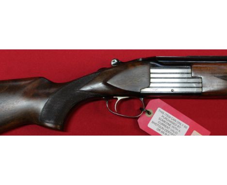 A 12 bore over and under shotgun by A Richardson &amp; Sons Halesworth, multi choke with set of chokes included, selective sa