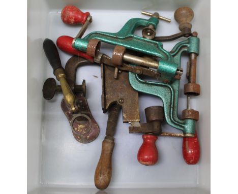 Three shotgun reloading tools with a capper/de-capper