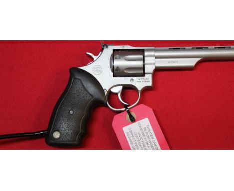A .357 long barrel revolver (with arm support) by Taurus, S/No.IW-173472, in overall very good condition, this item can only 
